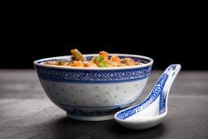 Traditional asian shrimp soup in a bowl